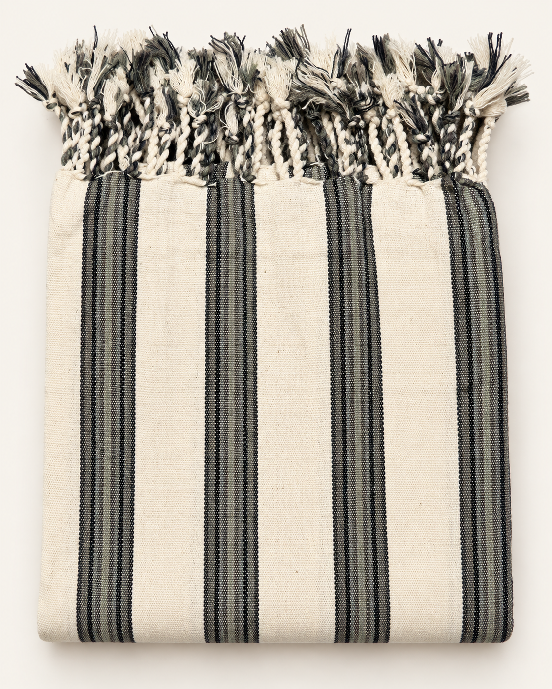 Slate & Ivory handloom Turkish towel featuring charcoal-gray and black woven stripes on natural ivory cotton with hand-braided fringes.