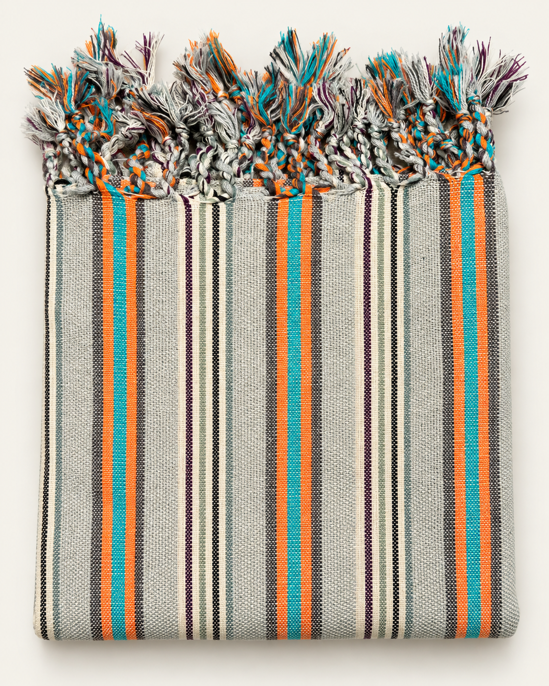 Turquoise Ember handloom Turkish towel with turquoise, orange, charcoal and plum woven stripes, textured ivory cotton and individually hand-braided fringes.